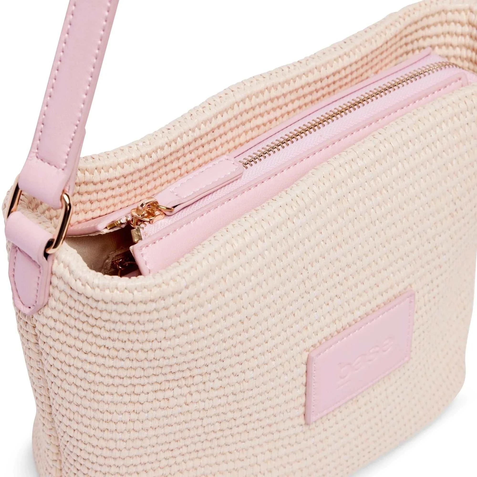 Base Supply Panier Crossbody bag in pink woven straw with adjustable strap and zip-top closure