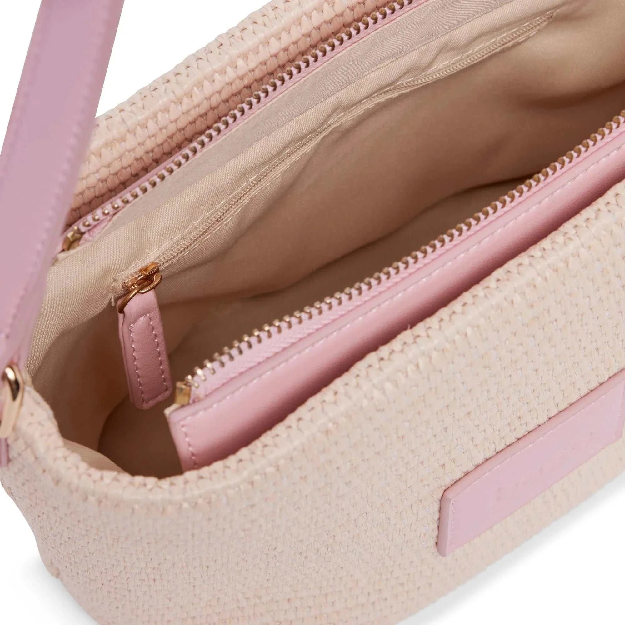 Base Supply Panier Crossbody bag in pink woven straw with cotton lining and zip pocket interior view