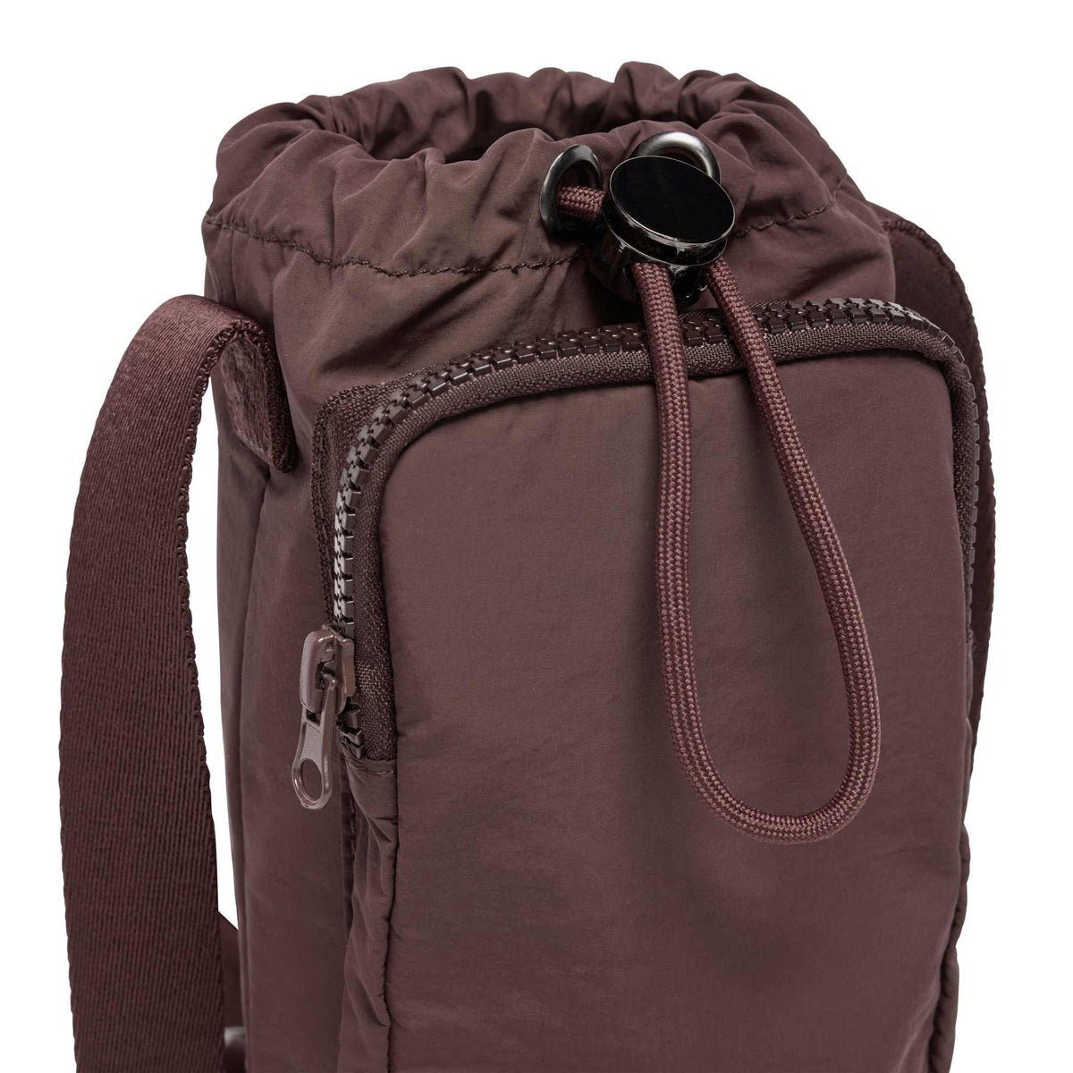 Base Supply Bottle Sling crossbody in chocolate color, waterproof with adjustable strap and front zipper pocket