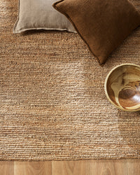 Baya Papeete jute floor rug styled in a living room