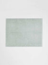 Paros Bath Mat in limestone color made from sustainable cotton with reversible design and high absorbency.