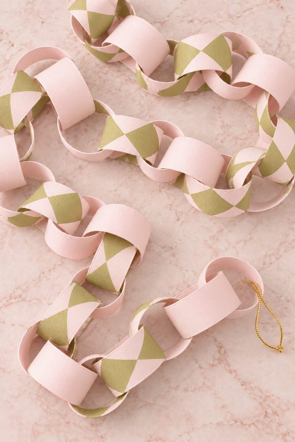 norsu STUDIO Christmas ribbon chain garland in blush and chartreuse harlequin, 2 metres, limited edition of 50