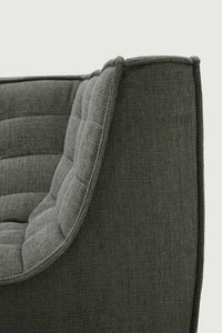 Close-up of Moss Eco fabric corner section of Ethnicraft Sofa N701 with high backrest and cushioned upholstery