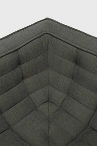 Close-up of the corner section of Ethnicraft Sofa N701 in moss eco fabric upholstery