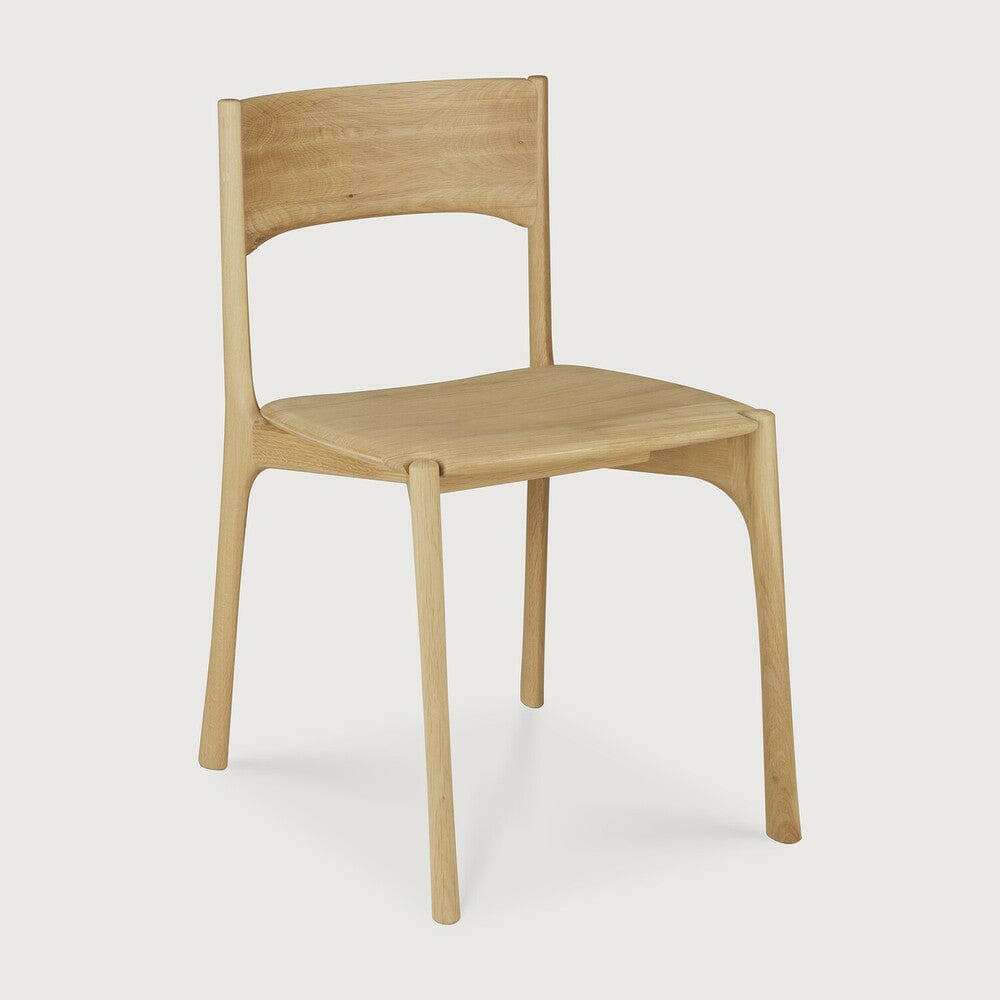 Ethnicraft PI Dining Chair in natural oak with sleek curved design and polished imperfect finish