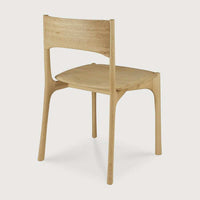 Ethnicraft PI Dining Chair in natural oak with sleek curved design and handcrafted finish