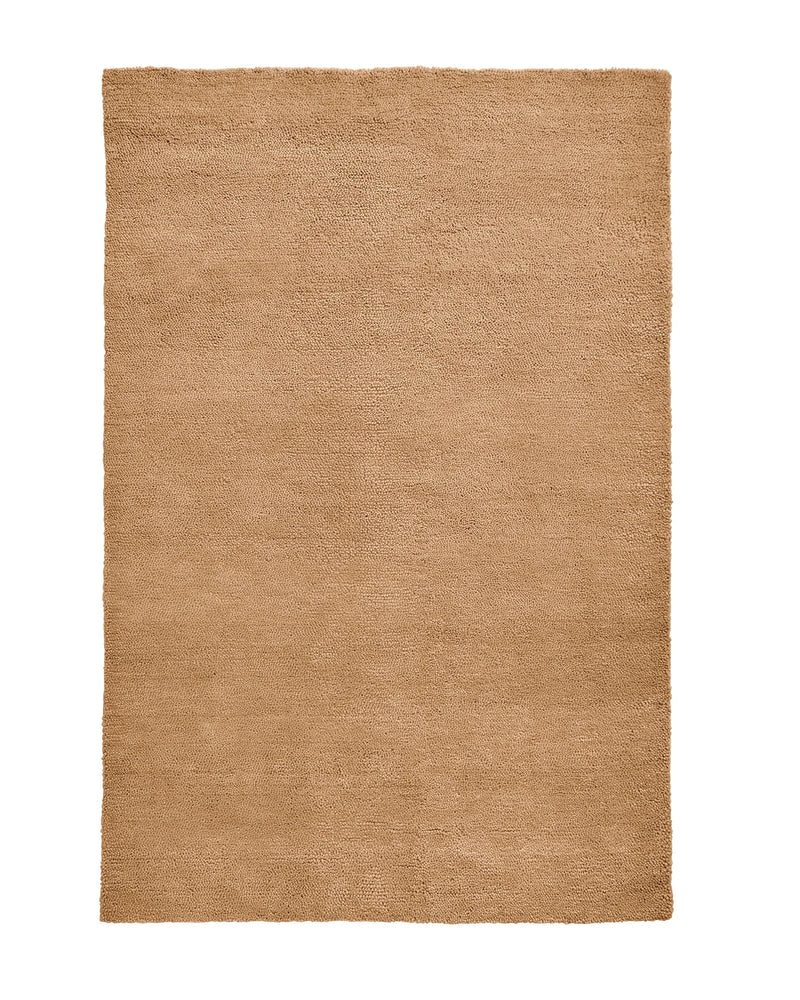Plush chunky camel Valencia Rug made of 100% wool with rich texture and warm golden tone