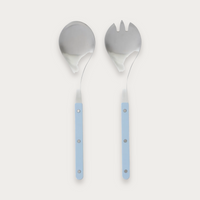 Remy salad servers with denim handles on a soft grey background
