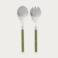 Remy salad servers with olive handles on a soft grey background