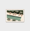 Middle of Nowhere Resort Pool print with green pool and striped umbrellas in a minimalist frame