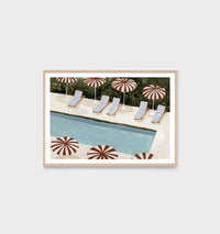 Middle of Nowhere Collection poolside print with nutmeg umbrellas and lounge chairs framed with a white border