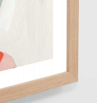 Close-up of Middle of Nowhere Resort Pool Print framed in oak with white border and pink abstract design