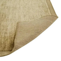 GlobeWest Bower Frame Rug in moss green, hand-woven 100% wool indoor area rug showing folded corner detail