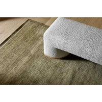GlobeWest Bower Frame Rug in moss green, hand woven 100% wool indoor rug with a simple silhouette.