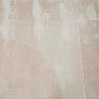 GlobeWest Tepih Curve Rug in sand color with subtle curved pattern and soft hand-woven texture for indoor use