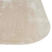 GlobeWest Tepih Curve Rug in sand color with soft hand-woven texture, indoor use, rounded corner design