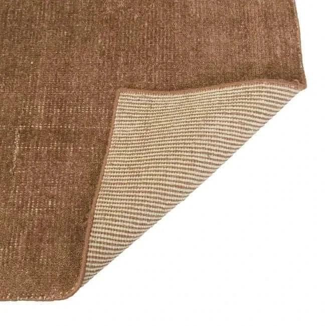 GlobeWest Tepih Neptune Rug in ginger color, hand-woven wool blend with a rustic textured surface and striped backing.