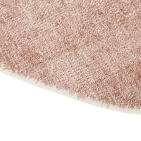Close-up of GlobeWest Tepih Neptune round hand-woven indoor rug in dusty rose with wool, silk, and cotton blend texture