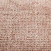 Close-up of GlobeWest Tepih Neptune round rug in dusty rose color with hand-woven wool, silk, and cotton texture