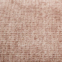 Close-up of GlobeWest Tepih Neptune round rug in dusty rose color with hand-woven wool, silk, and cotton texture