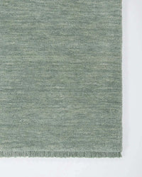 Baya Sandringham Floor Rug in aquamarine with a dense hand-knotted NZ wool pile and delicate fringing.