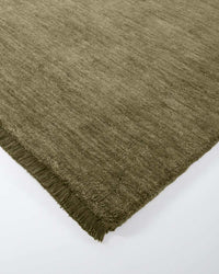 Baya Sandringham Floor Rug in basil green with dense wool pile and delicate fringing, hand-knotted from 100% NZ wool.