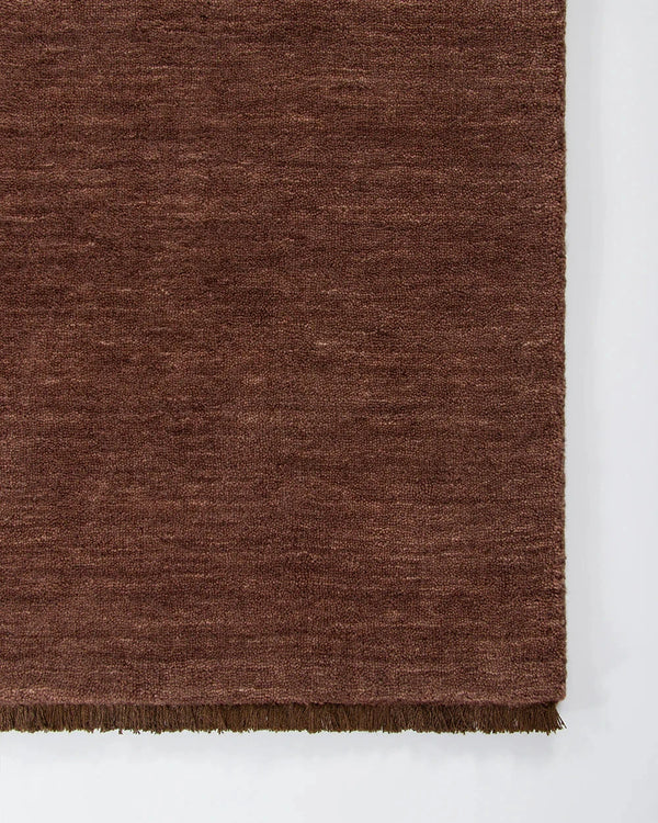 Baya Sandringham Floor Rug in Oxblood red with hand-knotted wool pile and delicate fringing