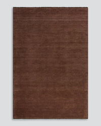 Baya Sandringham Floor Rug in oxblood red with dense pile and fringe ends
