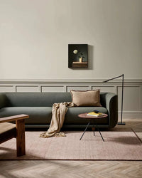 Baya Sandringham Floor Rug in rosewood color, hand-knotted wool rug with soft pile and delicate fringe in a modern living room setting