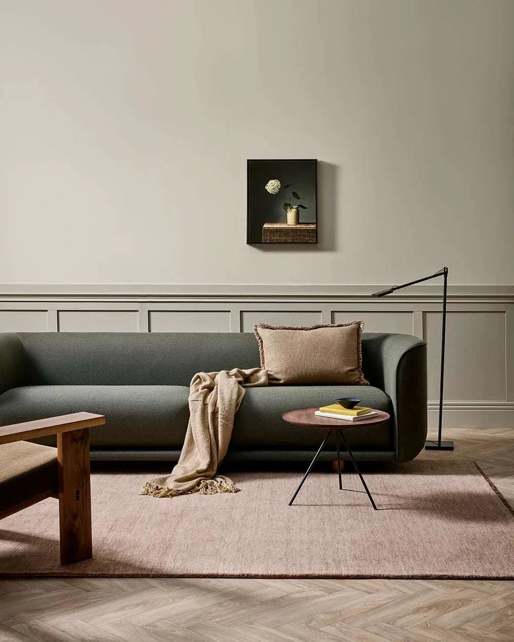 Baya Sandringham Floor Rug in rosewood color, hand-knotted wool rug with soft pile and delicate fringe in a modern living room setting