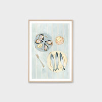 Framed Middle of Nowhere Seaside Canapes print featuring seafood still life in blue tones with a white border