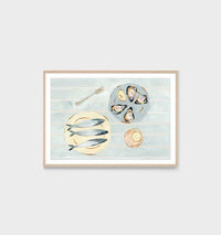 Framed Middle of Nowhere Seaside Canapes Print featuring still life of seafood on blue background with white border.