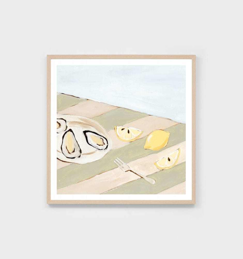 Middle of Nowhere seaside dining still life print with oysters, lemon wedges, and fork on a striped sage tablecloth in a light wood frame