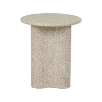 Artie Outdoor Wave Side Table in warm sand fibrestone with a round top and wavy base for outdoor use