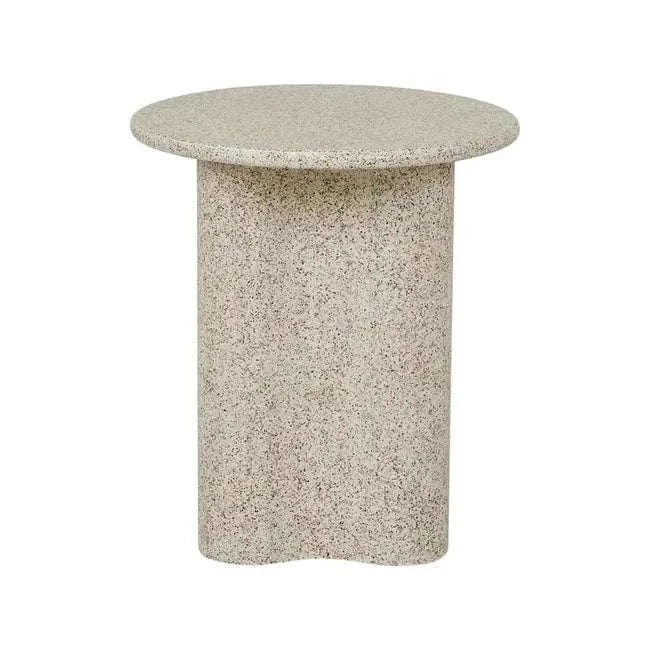Artie Outdoor Wave Side Table in warm sand fibrestone with a round top and wavy base for outdoor use