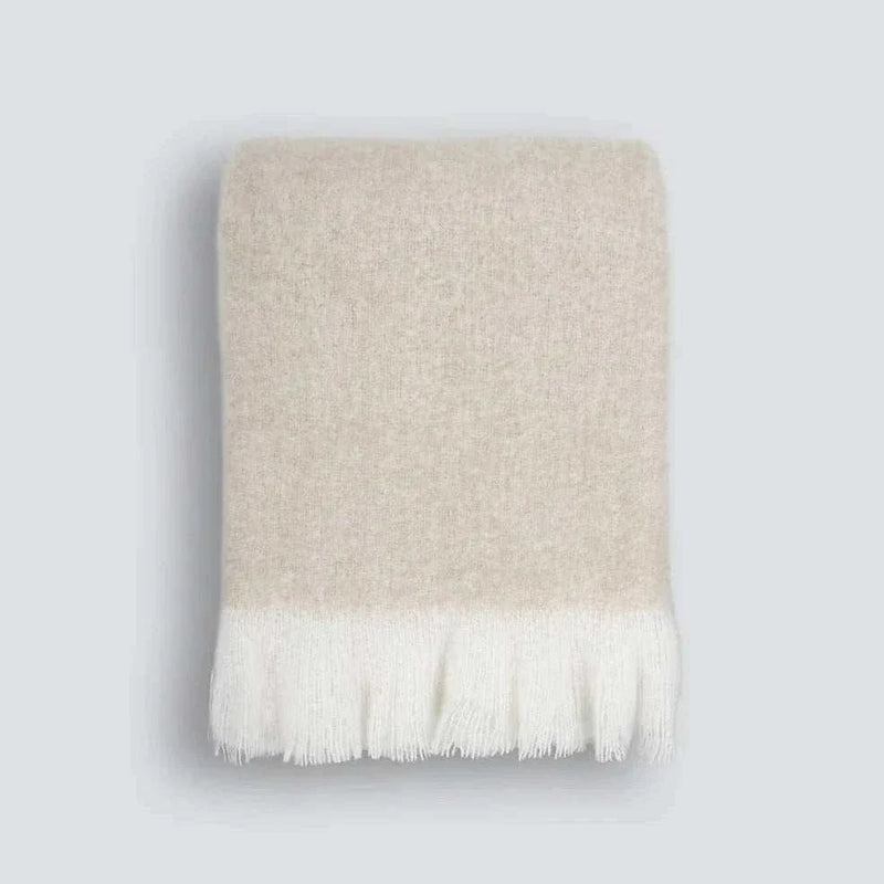 Baya Sorrento Throw in off-white with soft brushed wool blend and feathered fringe detail