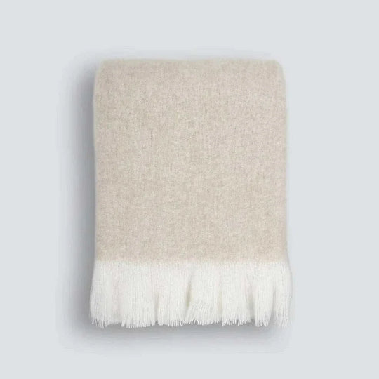 Baya Sorrento Throw in off-white with soft brushed wool blend and feathered fringe detail