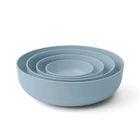 Set of four sky blue Styleware nesting bowls made of BPA-free polypropylene, microwave and dishwasher safe.