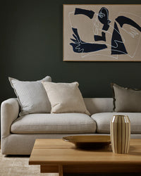 Baya Sutton Cushion in oat color with cotton-linen chenille fabric, textured yarns, and fringe border.
