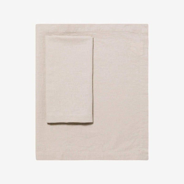 L&M Terrace Oatmeal Tablecloth made from 55% French linen and 45% cotton blend in a soft oatmeal color, available in various sizes.