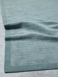 Tait Rug Steele Blue hand-loomed wool and cotton with textured tip-sheared finish