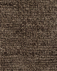 Close-up of Baya Tanami Floor Rug in earthy brown hand-knotted wool texture