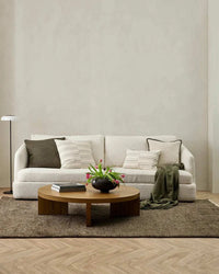 Baya Tanami Floor Rug in earthy brown tone, hand-knotted New Zealand wool rug with ribbed texture and soft cotton fringe in modern living room setting