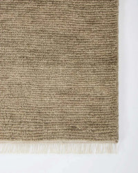 Baya Tanami Floor Rug in natural taupe with hand-knotted ribbed texture and soft cotton fringe made from 100% New Zealand wool