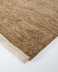 Baya Tanami Floor Rug in treacle color with hand-knotted ribbed texture and soft cotton fringe made from 100% New Zealand wool