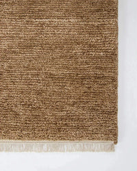 Baya Tanami Floor Rug in warm treacle tone with hand-knotted ribbed texture and soft cotton fringe