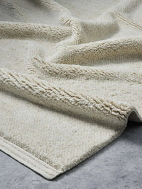 Hand-loomed Vogel Rug Honey with soft wool pile and linear border design