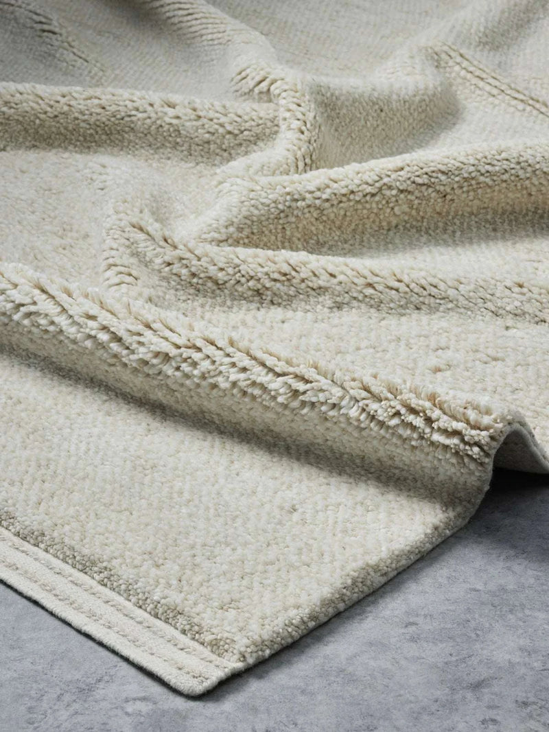 Hand-loomed Vogel Rug Honey with soft wool pile and linear border design