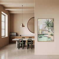 Limited edition fine art canvas print "Wish You Were Here" by Georgie Wilson displayed in modern neutral dining room with floating oak frame