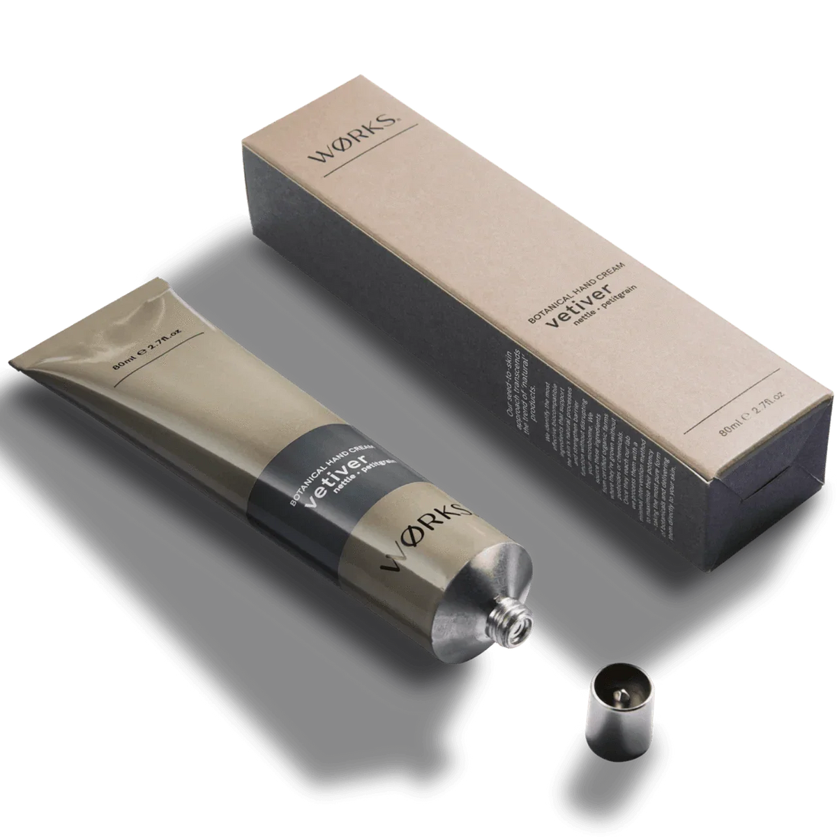 Works Hand Cream tube in aluminium packaging with vetiver scent, featuring plastic-free design and natural moisturizing ingredients.